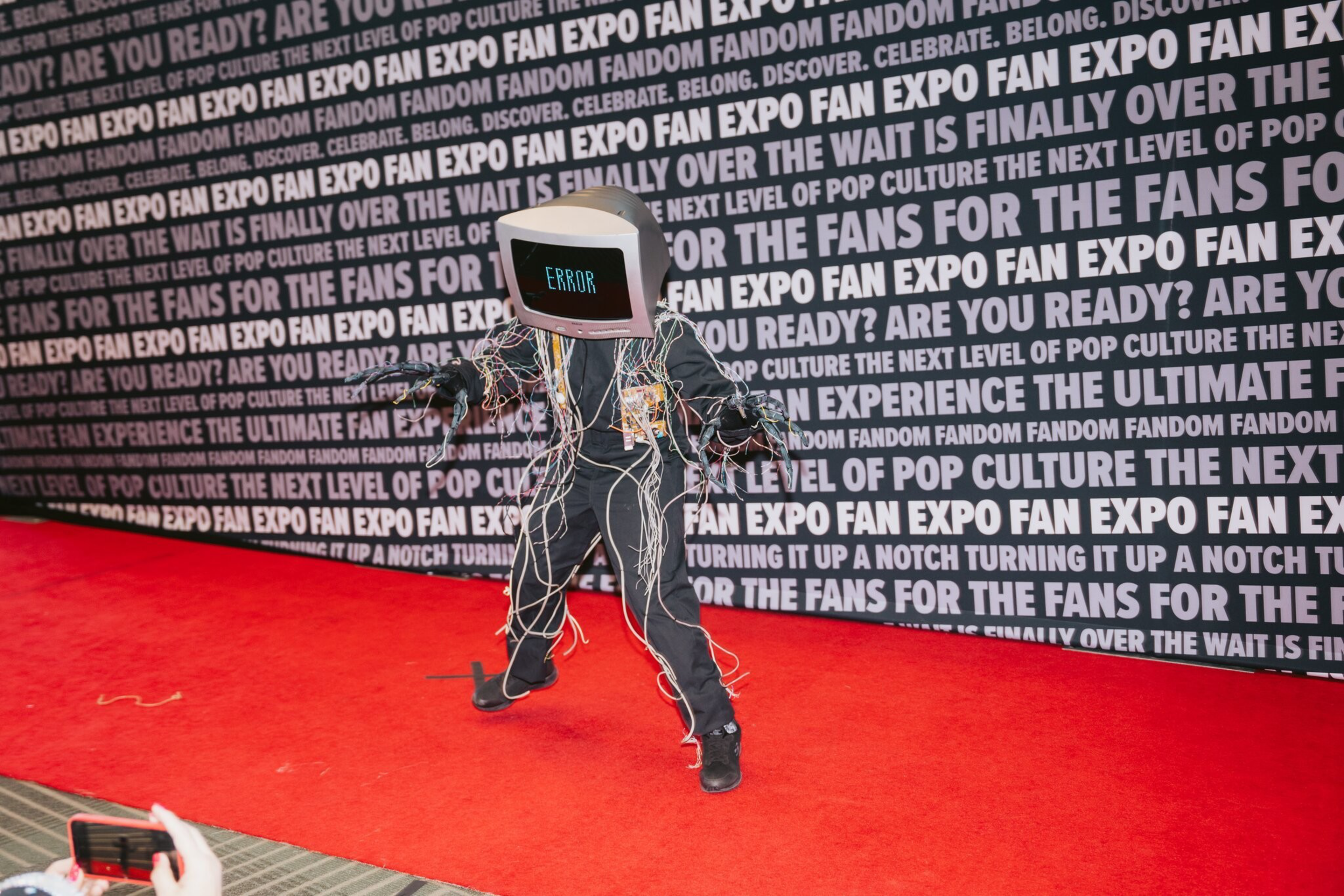 a person in a costume with hands outstretched and an error message