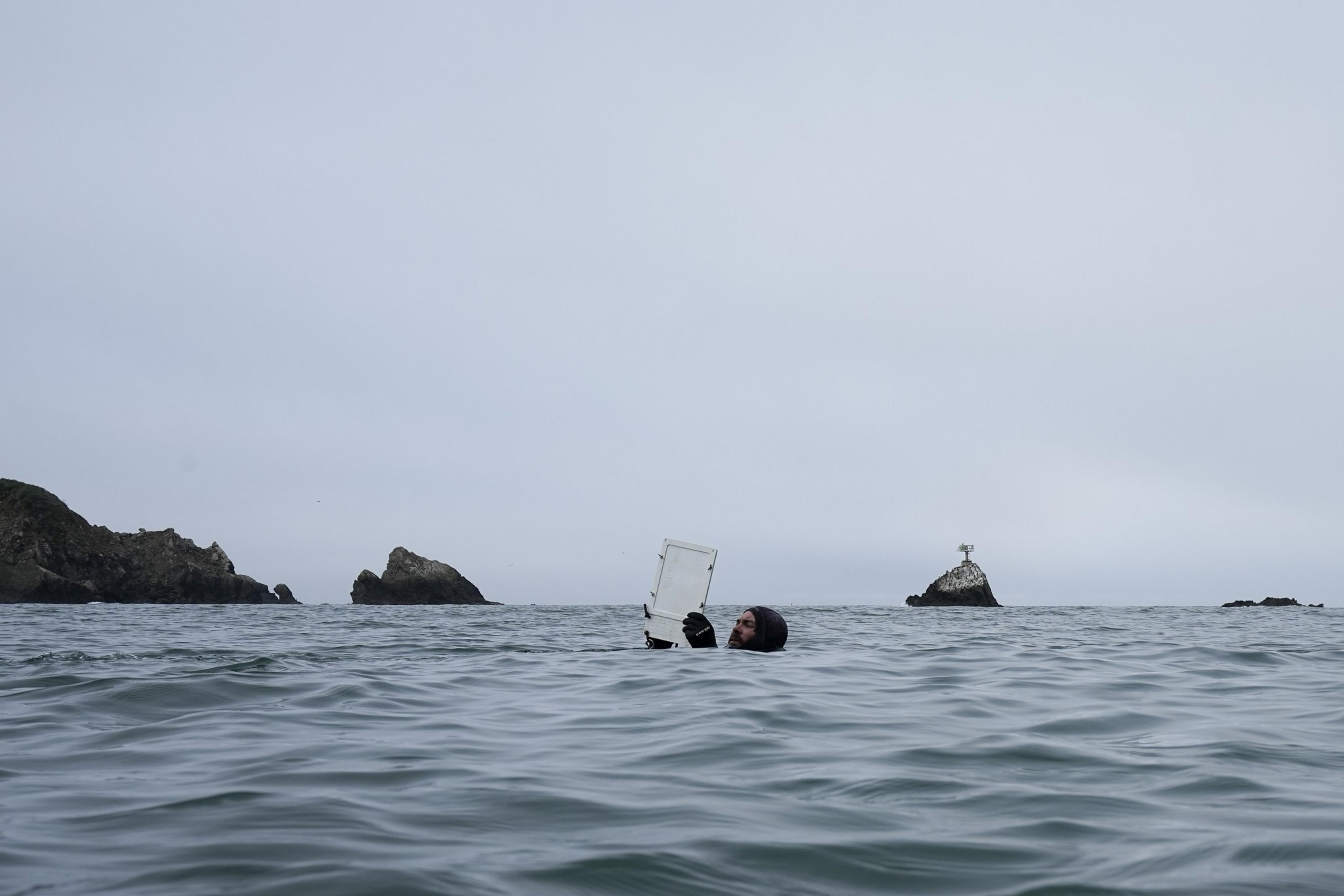 A diver floats on the water