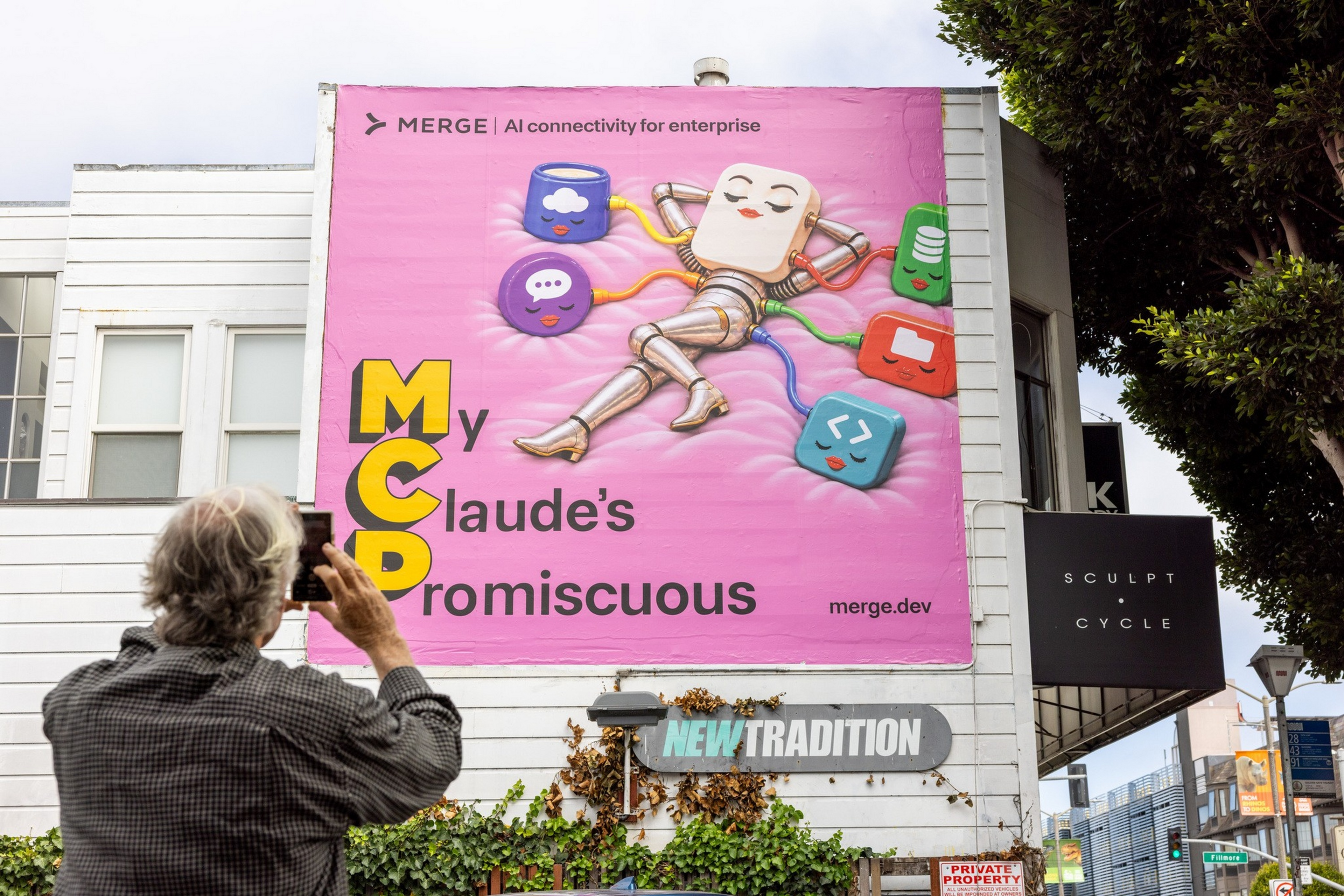 A billboard features a robot with a toast-shaped head reclining ...