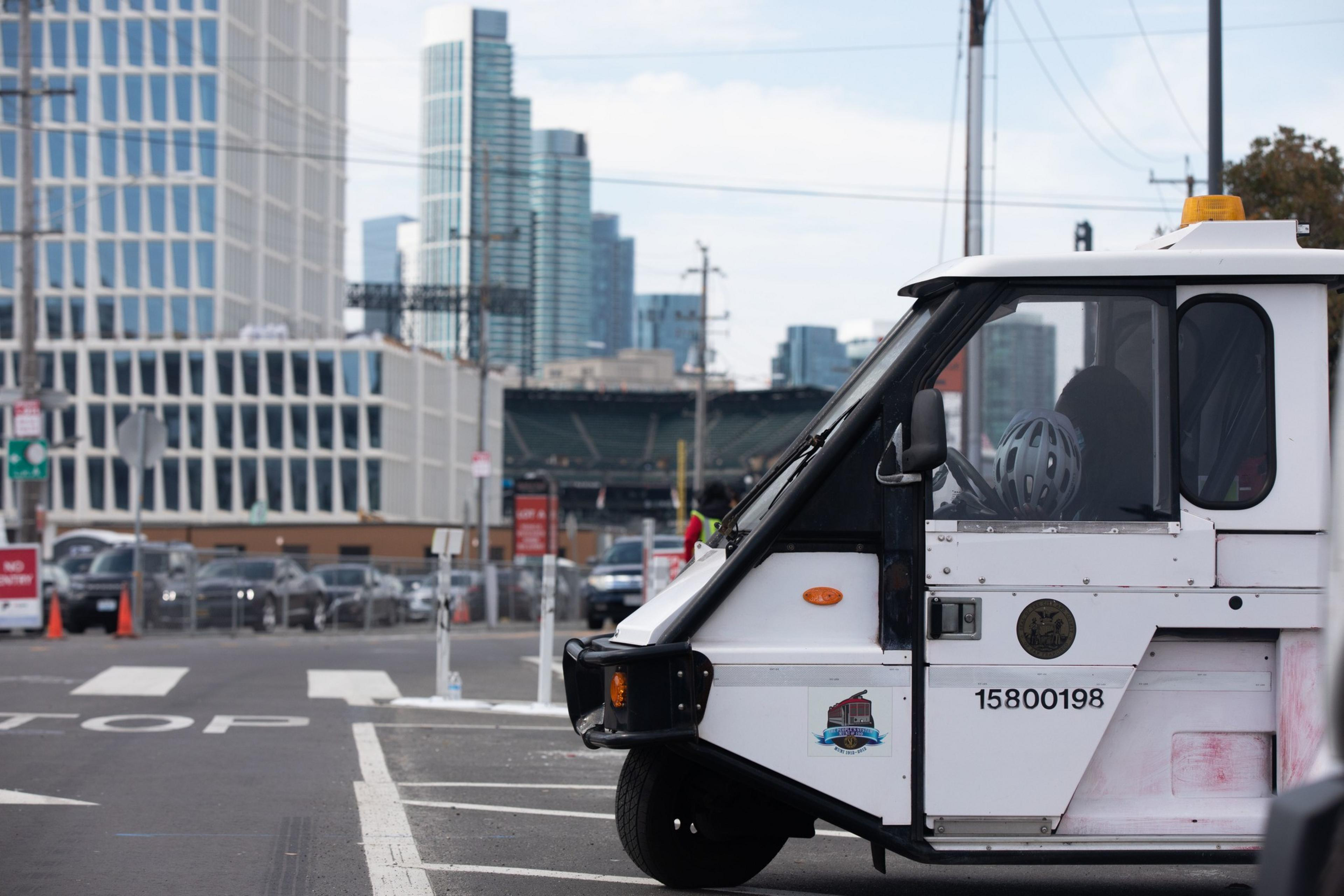 A parking control officer waits in their vehicle near Oracle Park in San Francisco.