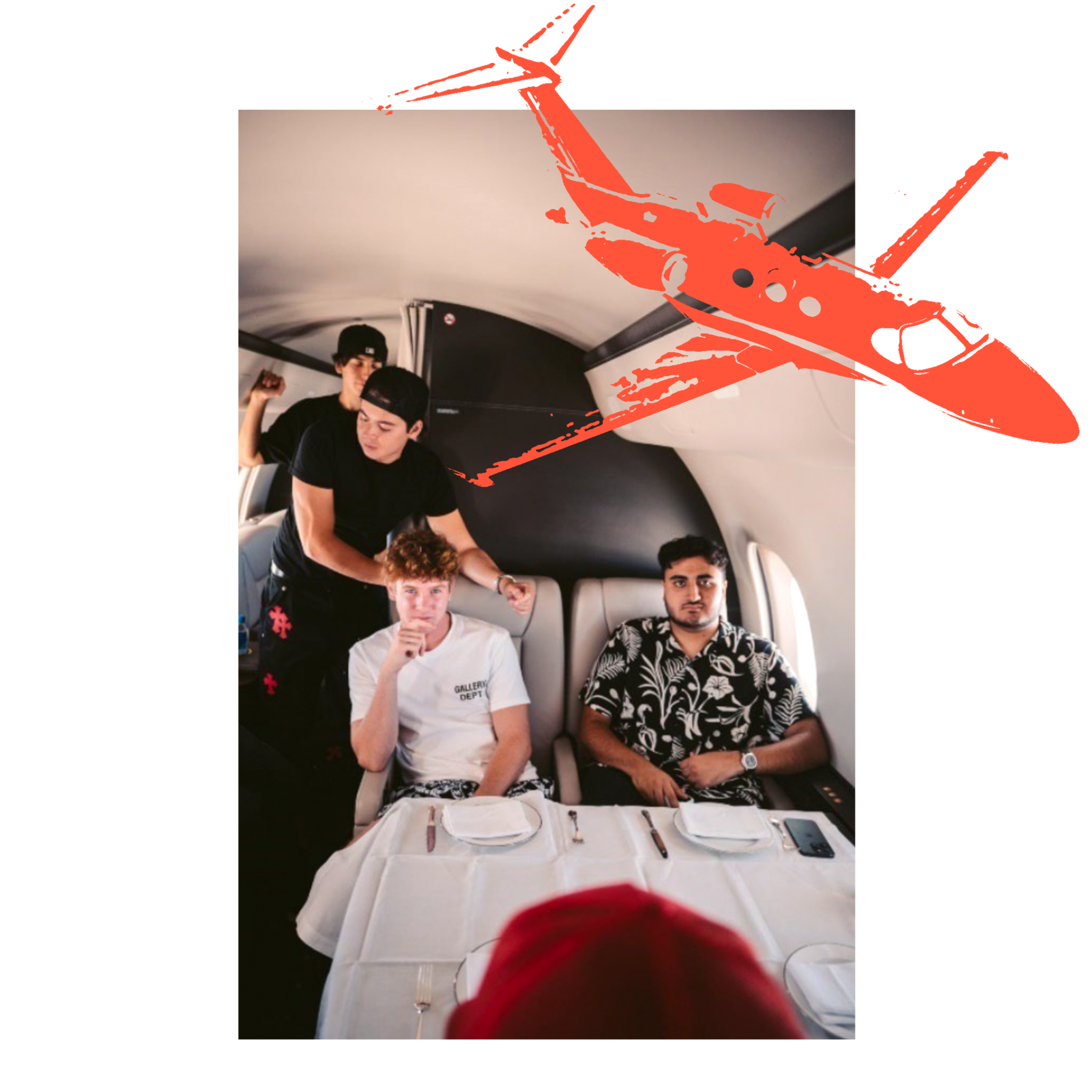 Four young men are seated inside a private jet around a table set with plates and cutlery, with a yellow airplane graphic overlaying the image.