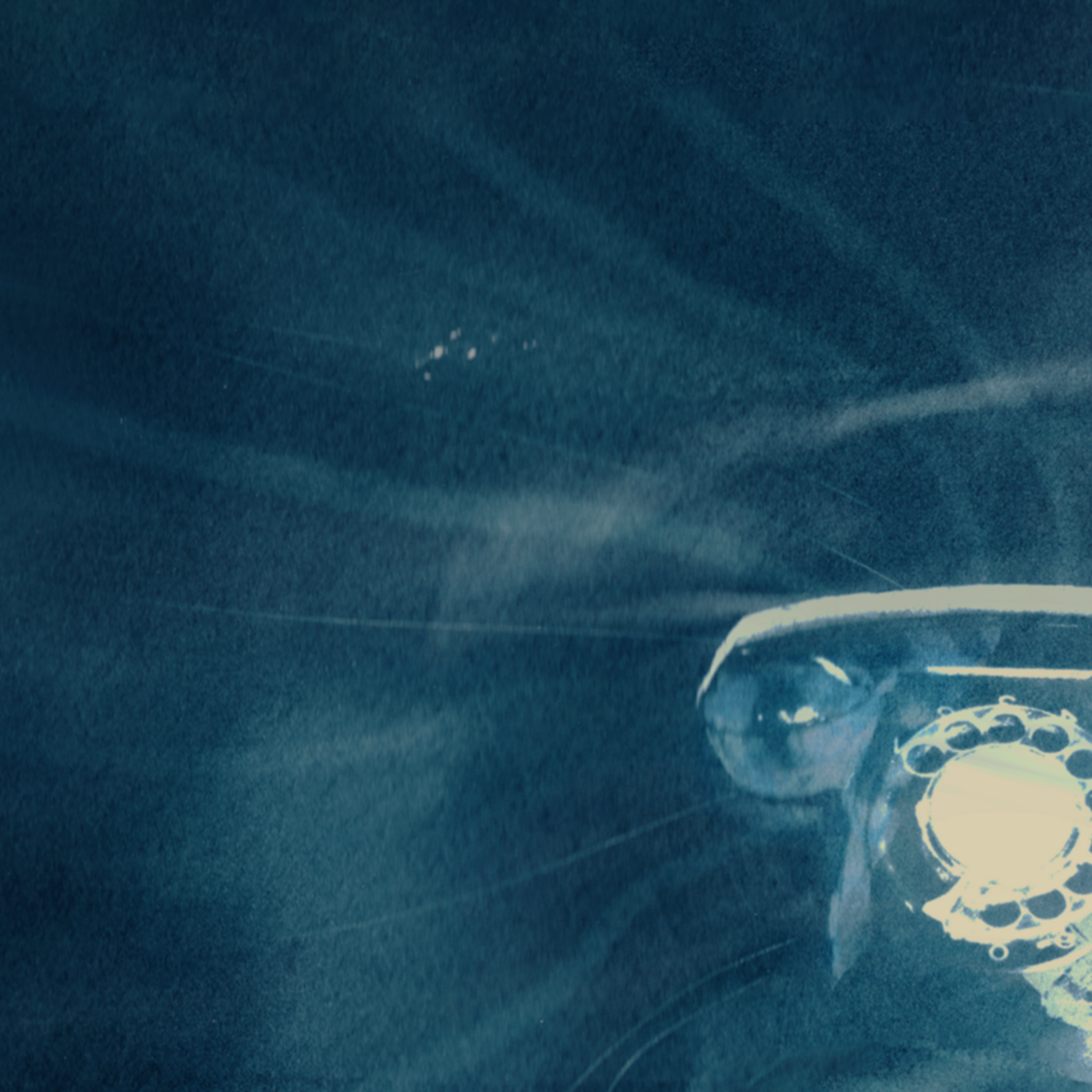 An illustration of a telephone surrounded by soundwaves.