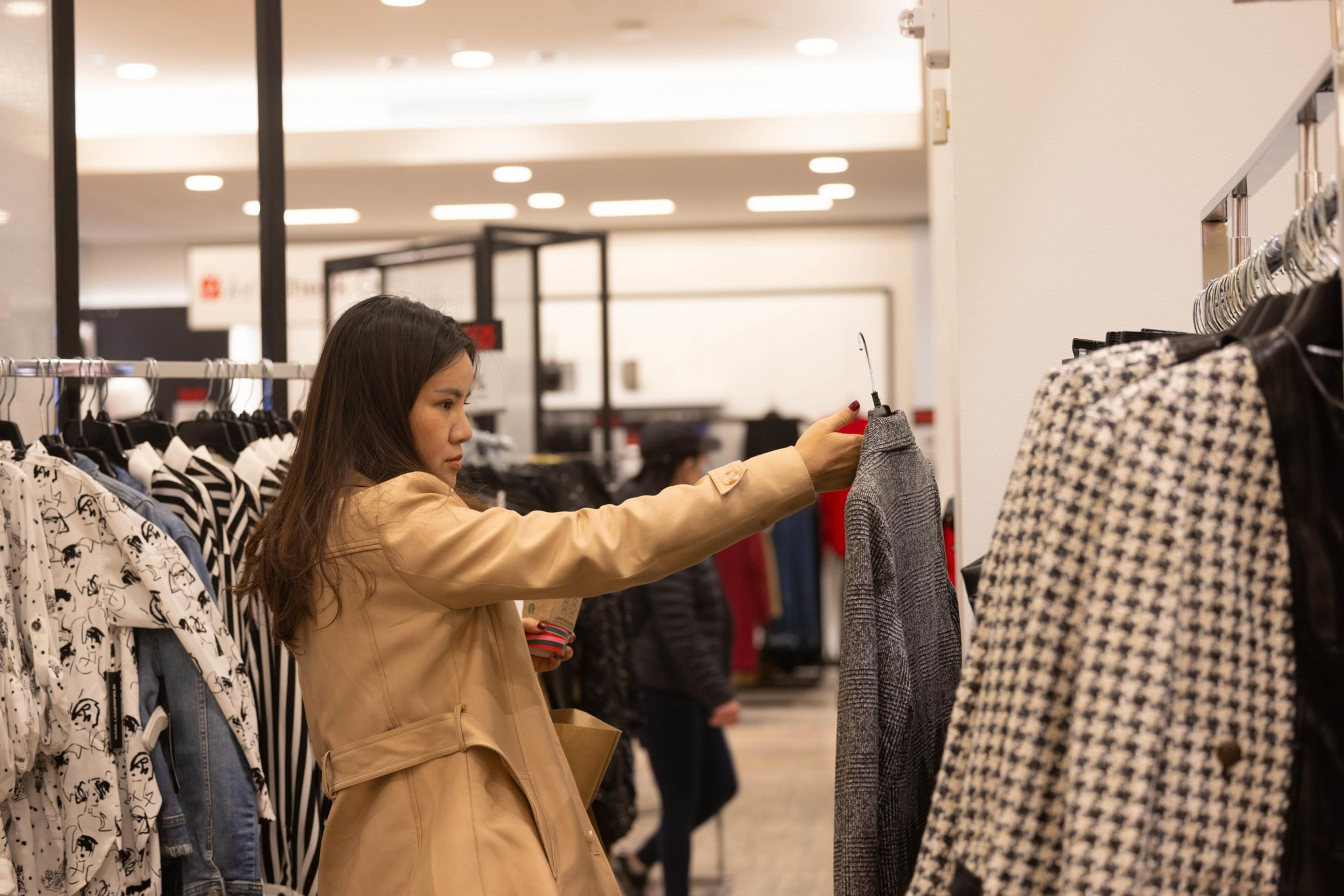 A shopper holds a jacket in Macy's in Union Square.