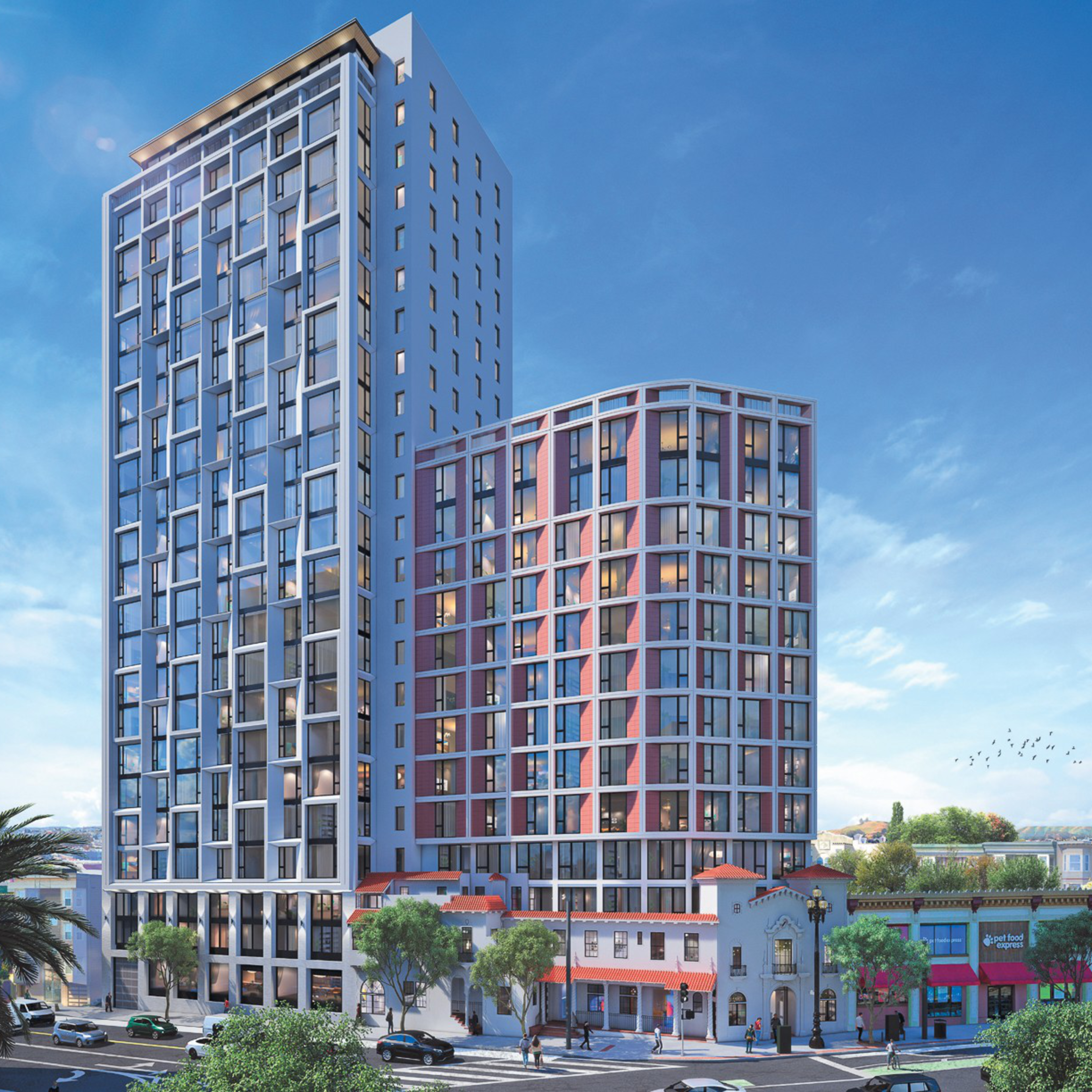 The image shows two modern, high-rise buildings with many windows, adjacent to a traditional, colorful low-rise structure on a busy street lined with trees and parked cars.