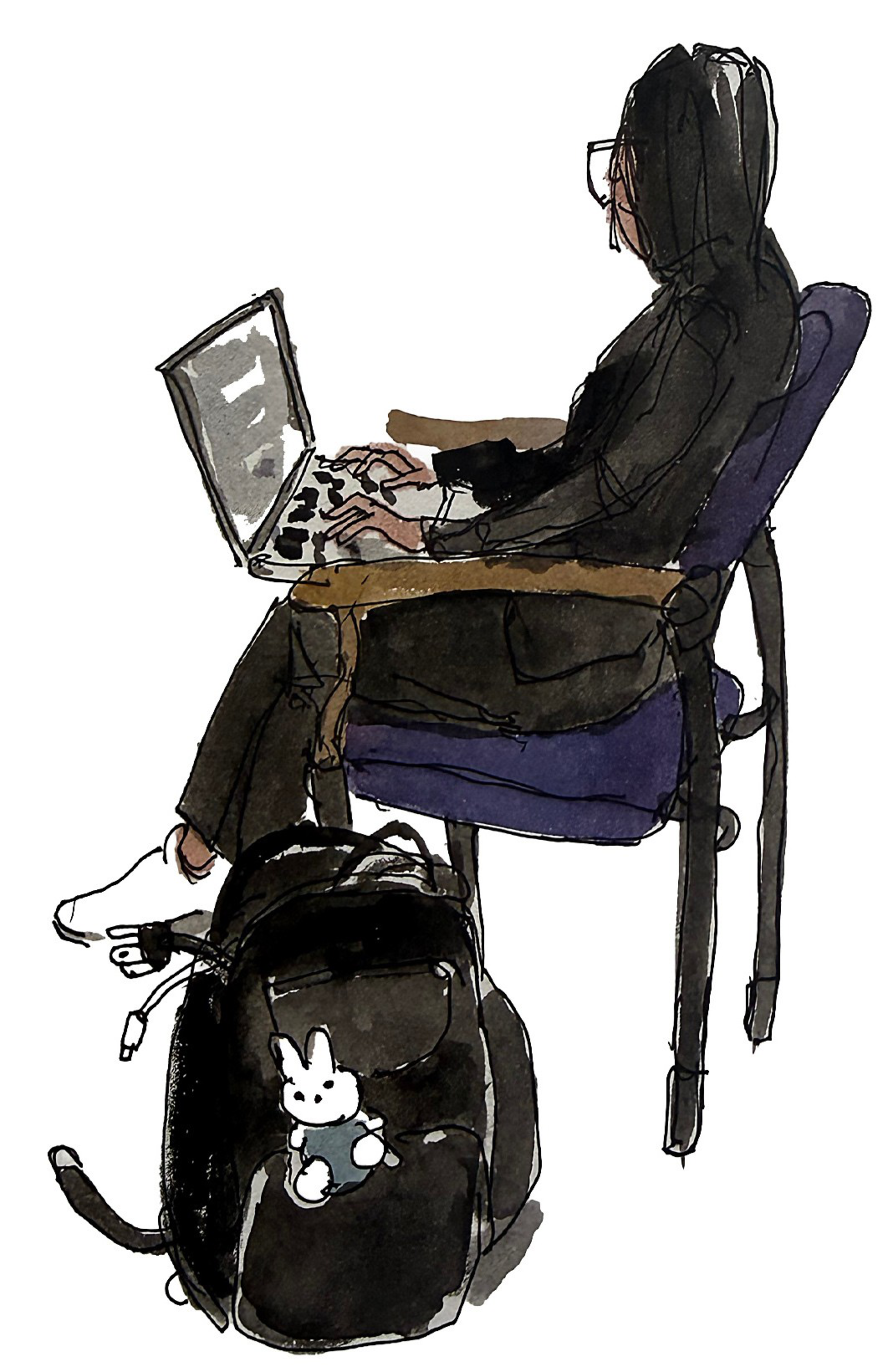 A person wearing a black hoodie sits on a purple chair typing on a laptop, with a black backpack featuring a small white bunny keychain on the floor.