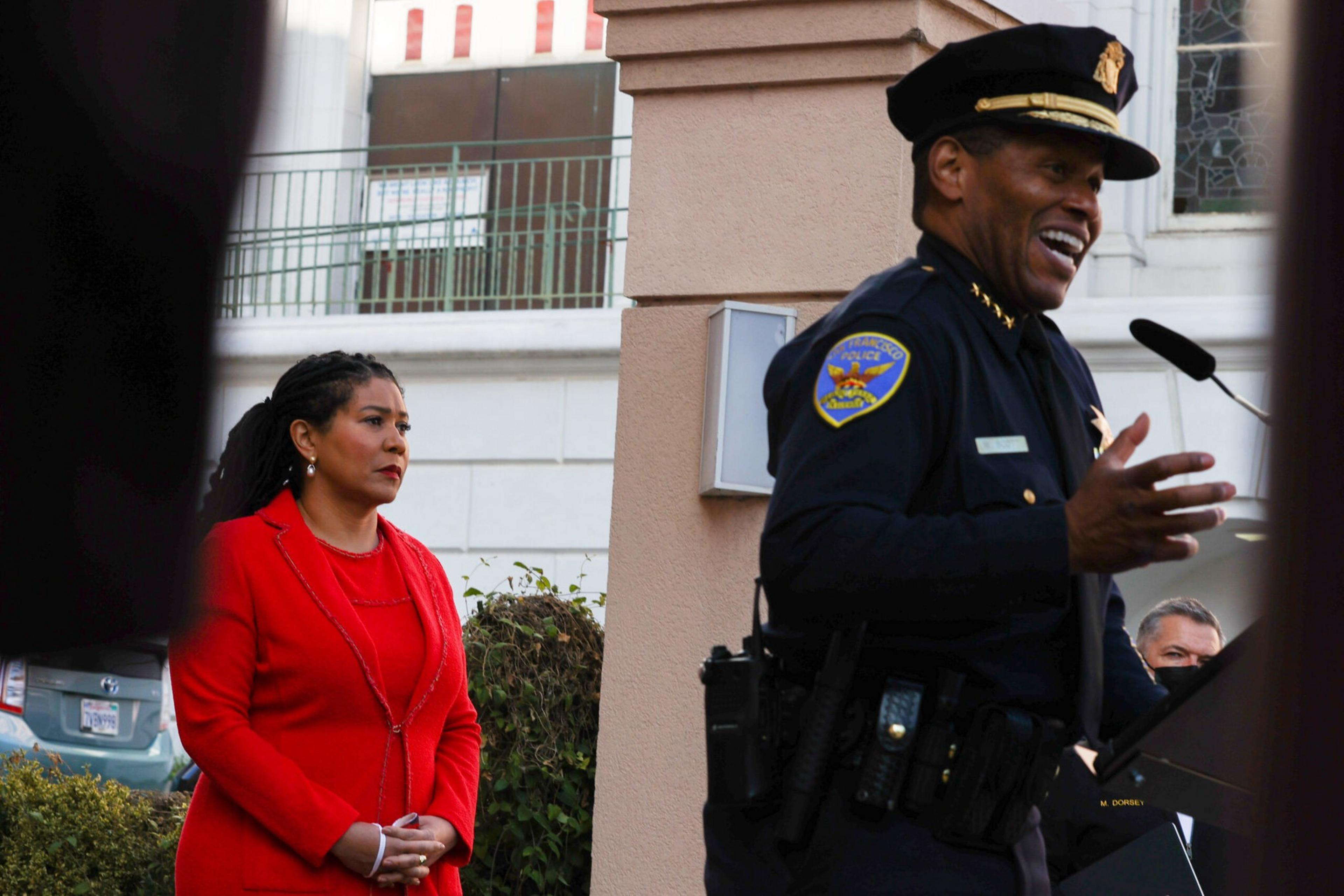 A police officer stands at a podium.