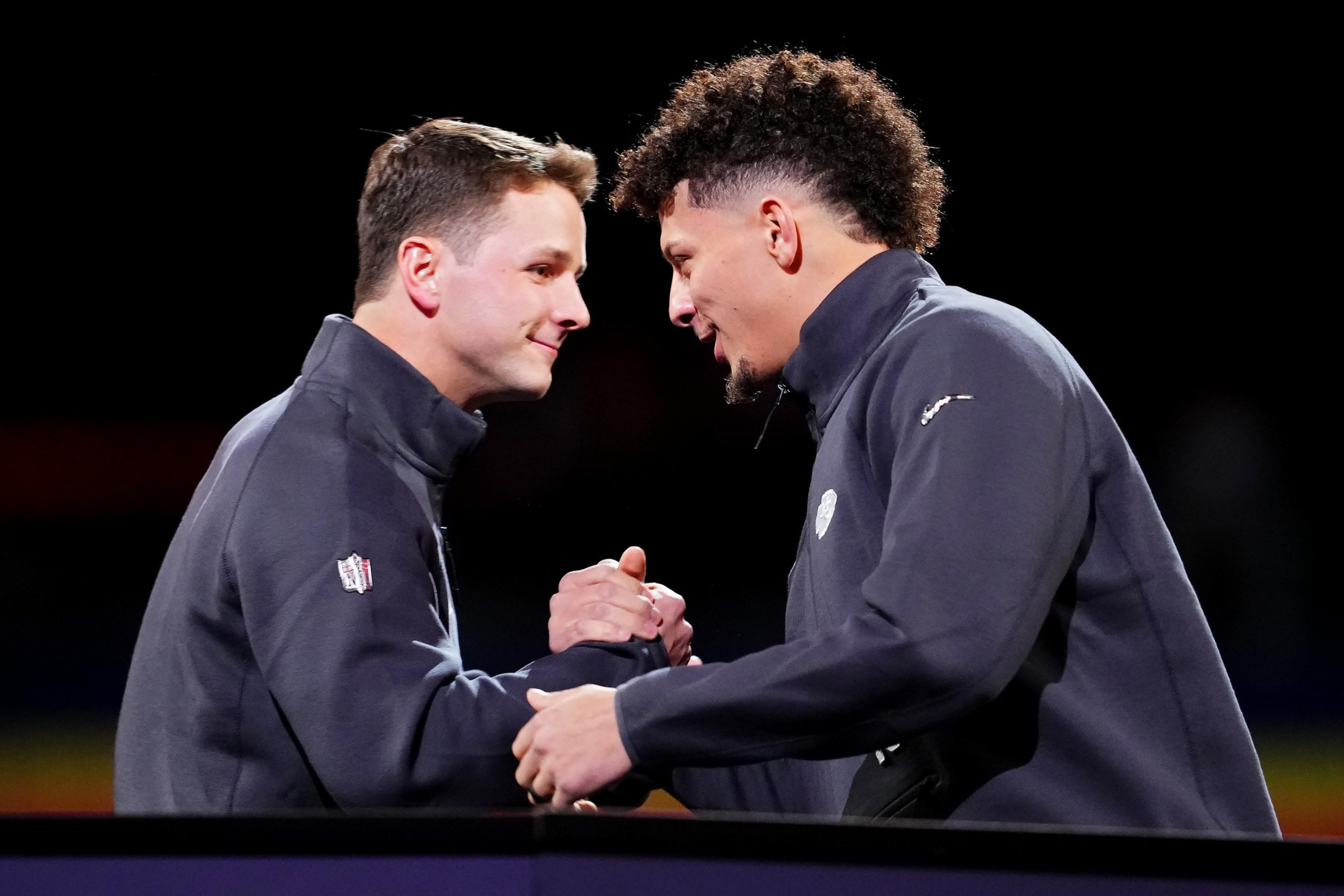 Purdy and Mahomes embrace