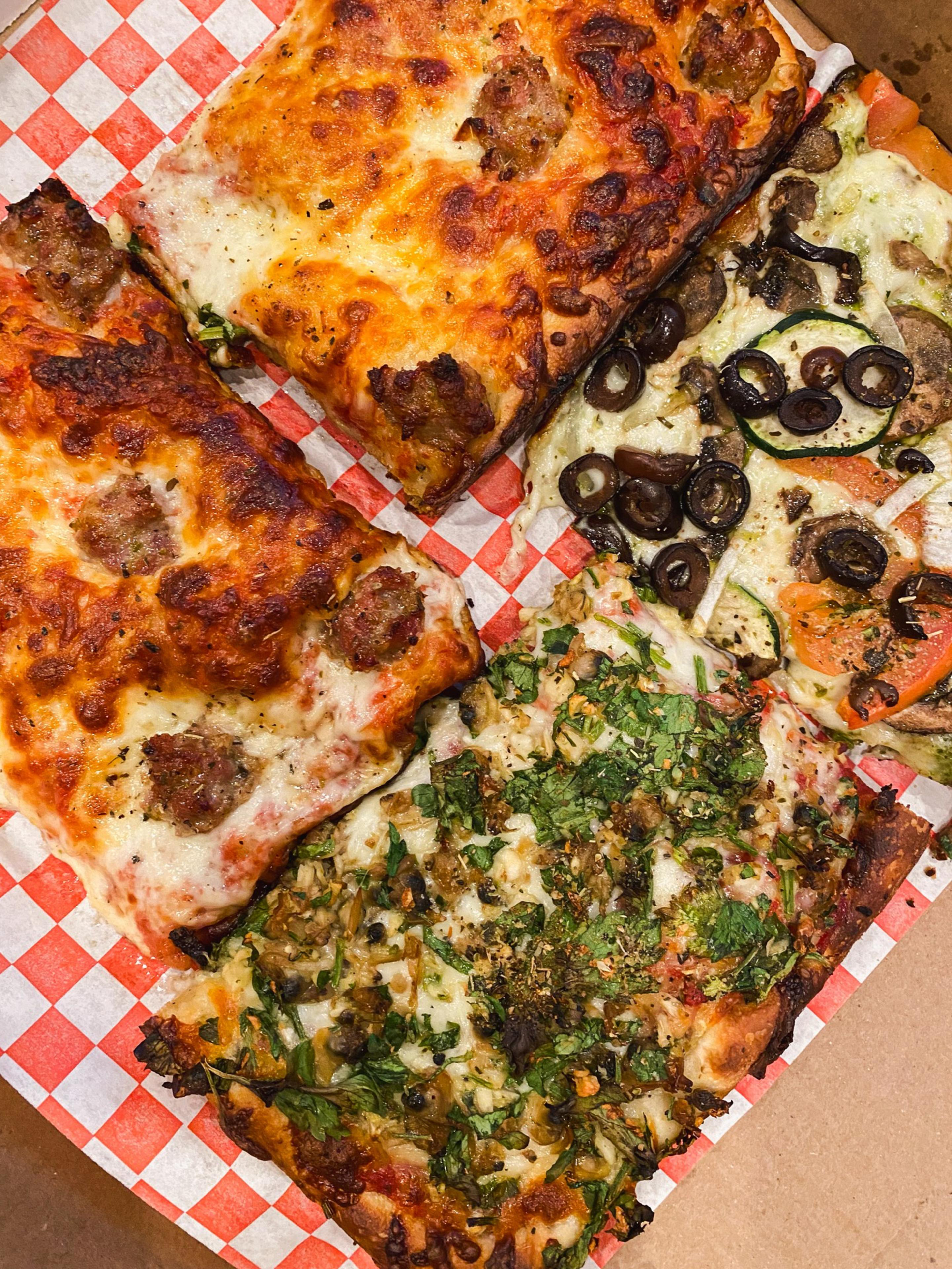Four square slices of pizza
