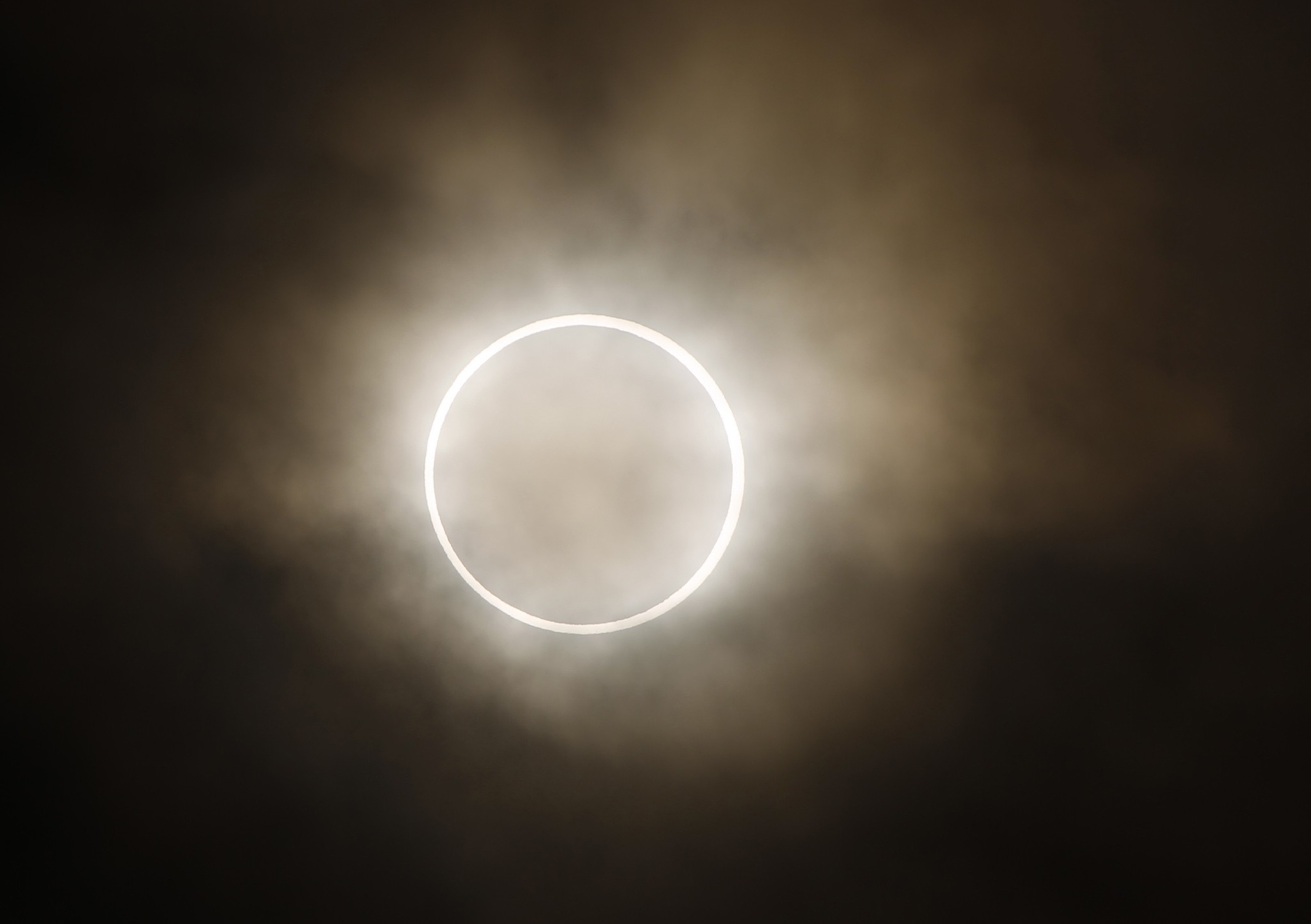 FILE - An annular eclipse is viewed from a waterfront park in Yokohama, Japan, near Tokyo, Monday, May 21, 2012. On Saturday, Oct. 14, 2023, an annular solar eclipse _ better known as a ring of fire _ will briefly dim the skies over parts of the western U.