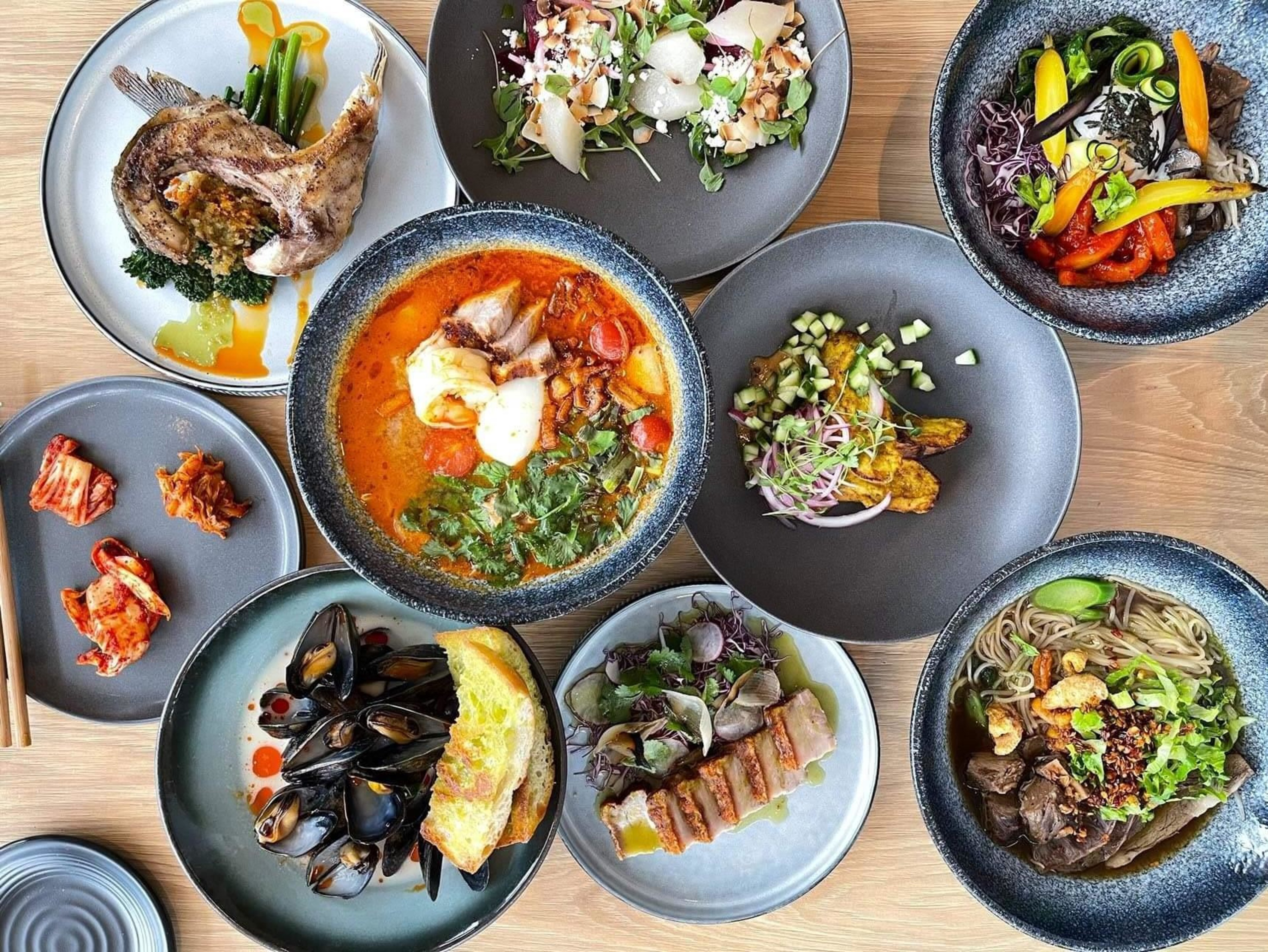 The dinner offerings at Kothai Republic include tom yum soup, kimchi and mussels. | Courtesy Sung Park/Kothai Republic