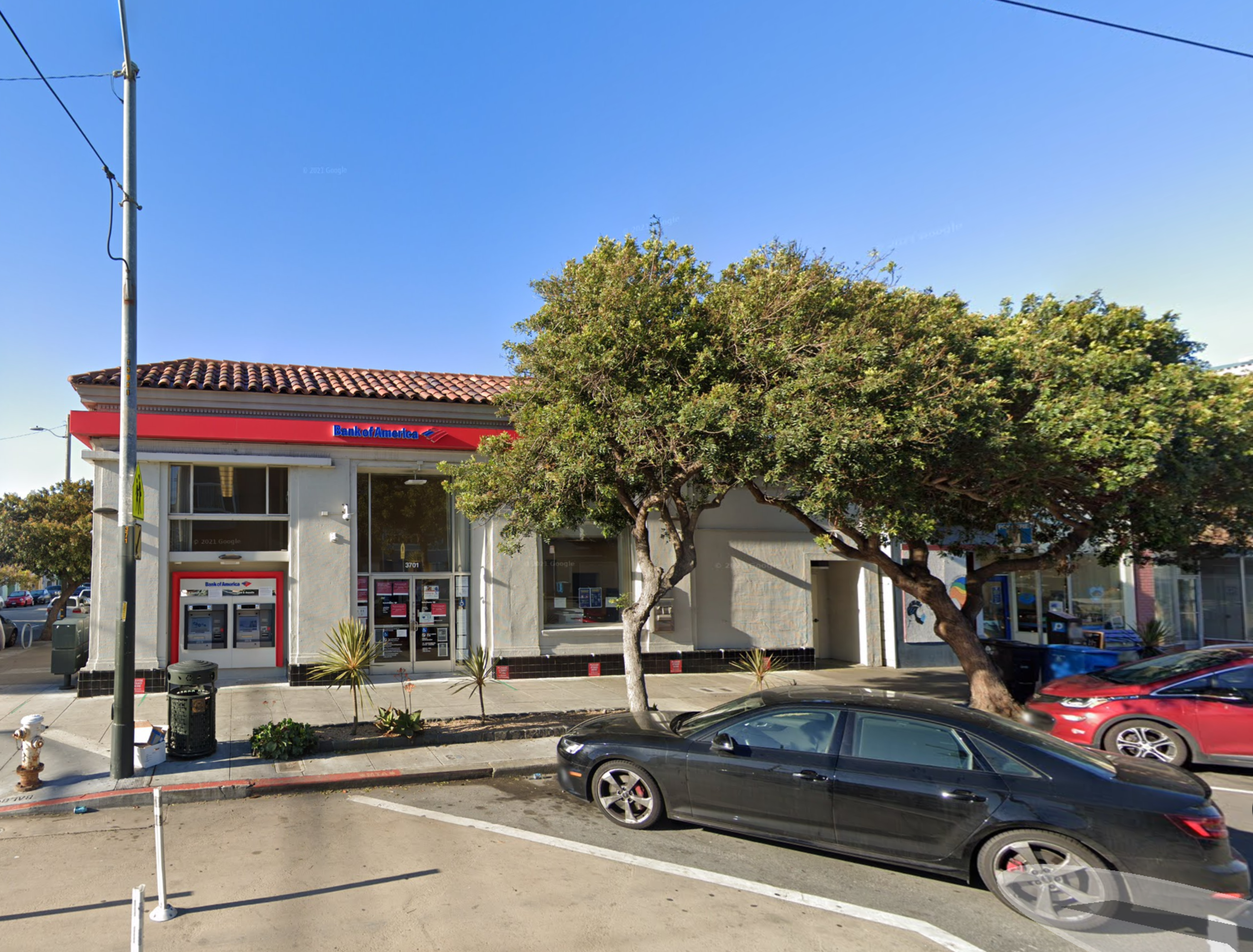 A Bank of America branch sits on a quiet street corner.