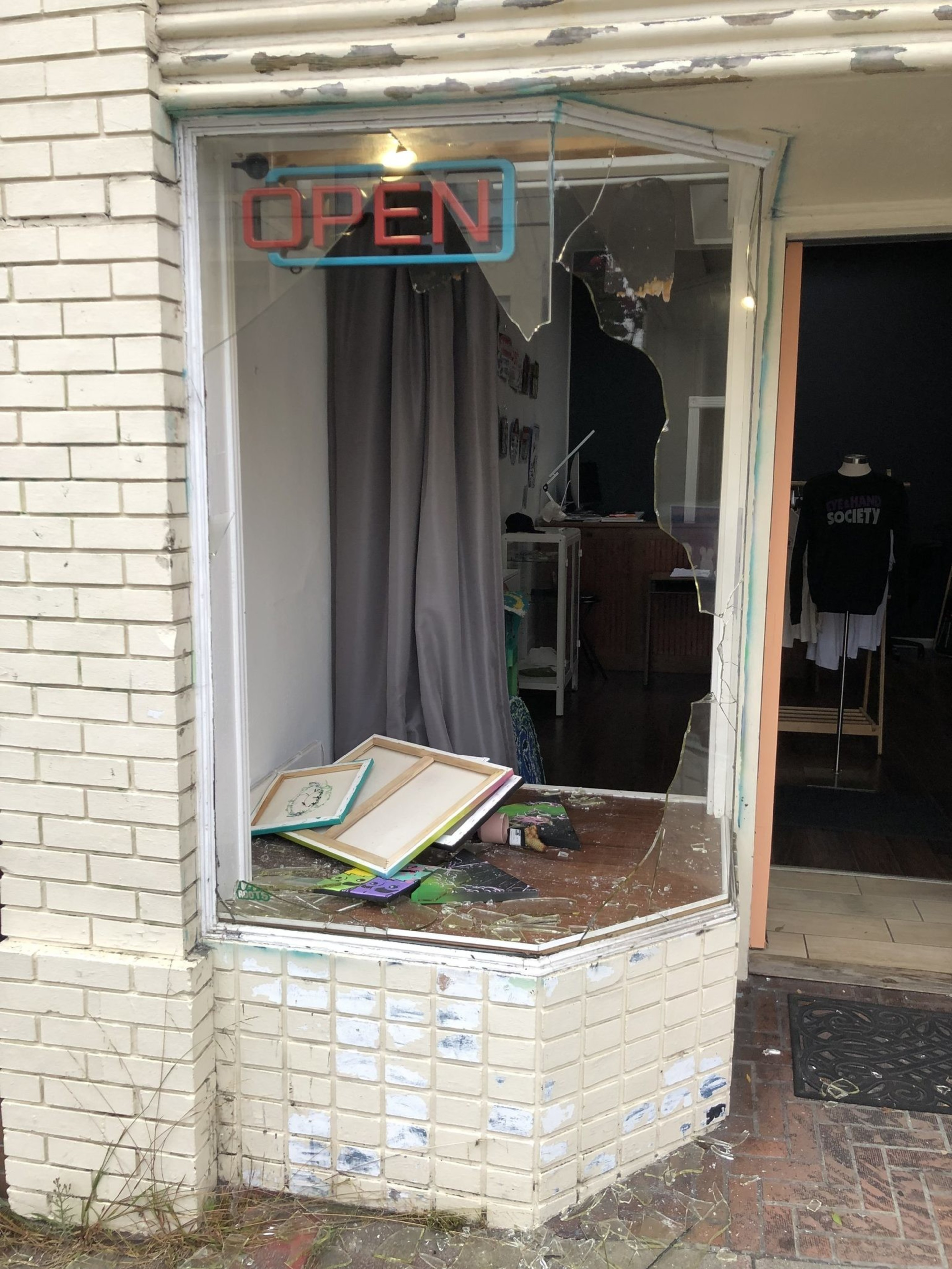 A shattered window on a storefront