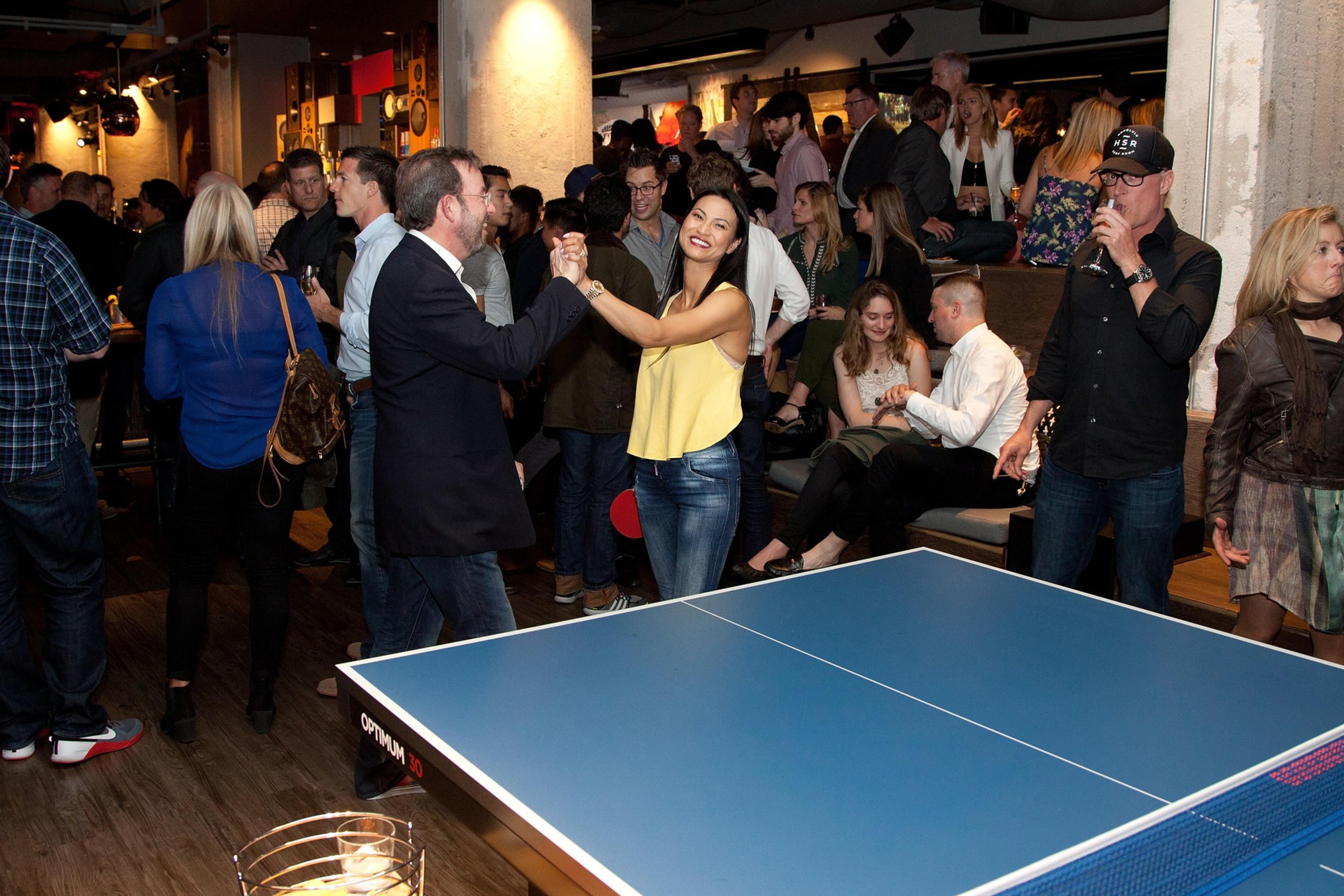 People mingle in a pingpong lounge in San Francisco.